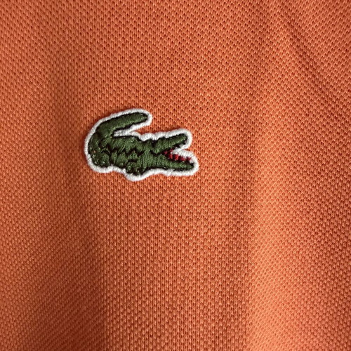 Lacoste polo shirt like new, size 3, peach color
