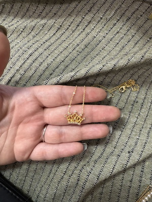 Necklace in gold color with crown design like new