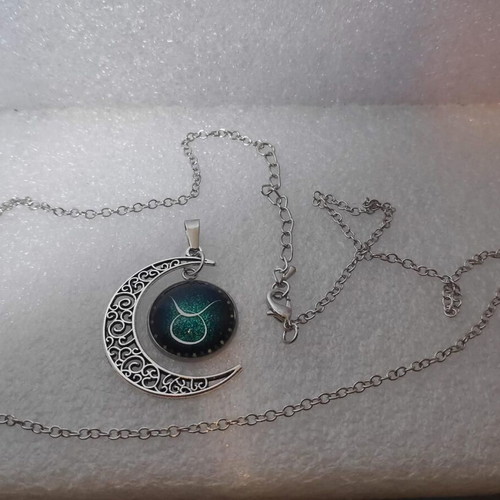 Pendant necklace with Taurus zodiac and crescent moon, like new
