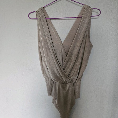 Beige-gold bodysuit like new with draped neckline and laser cut detail