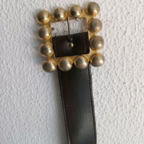 Belt used from faux leather with impressive brown buckle
