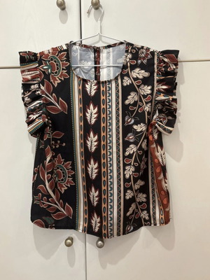 Blouse with ruffles one size new, button closure at back