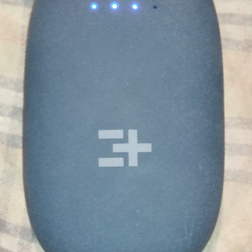 Powerbank with two USB ports used, includes two cables