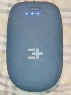 Powerbank with two USB ports used, includes two cables