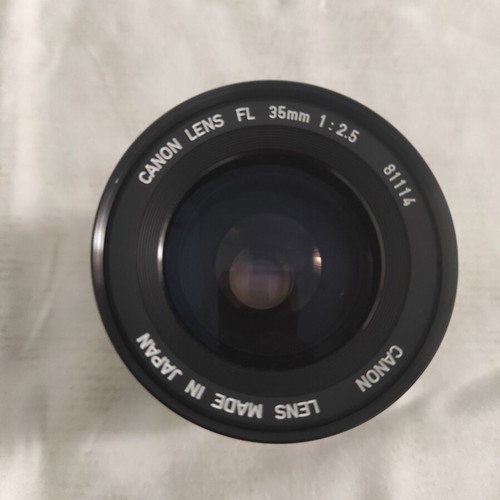 Canon FL 35mm f/2.5 wide-angle lens with HOYA 58mm 81A filter