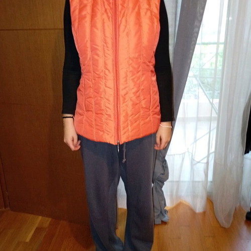 Sleeveless women's jacket like new, size large, orange