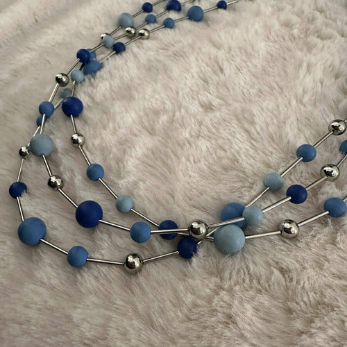 Silver necklace like new with blue beads in various shades