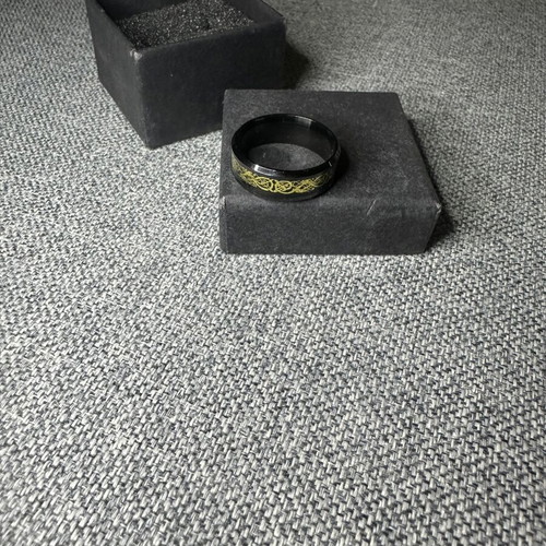 Ring with gold Celtic design on black base new
