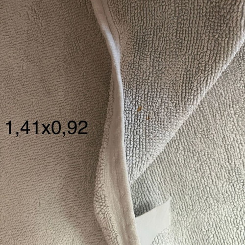 Bath towel used, light blue with printed fabric border