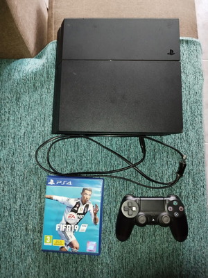 PlayStation 4 500GB console used with controller and FIFA 19 game