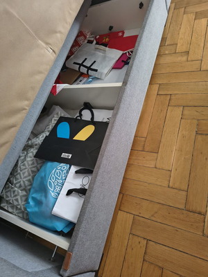 Two-seater sofa with storage and bed function