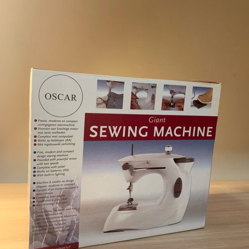 Sewing machine with battery like new with box and unused accessories