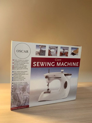 Sewing machine with battery like new with box and unused accessories