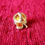 Gold brooch with Swarovski elements in clover shape used