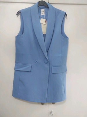 Blue vest new with box, comfortable fit