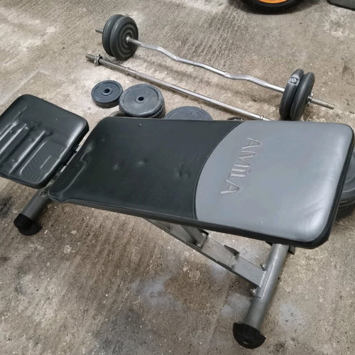 Gym equipment and weights used, set with Amila bench