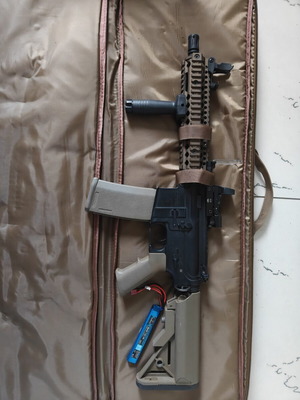 Airsoft equipment like new with radio, batteries, chargers, and BBs