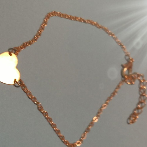 Gold-colored heart bracelet with chain