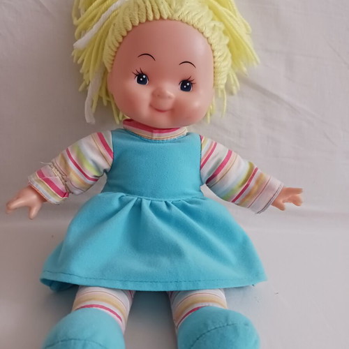 Doll with blonde yarn hair like new, soft body