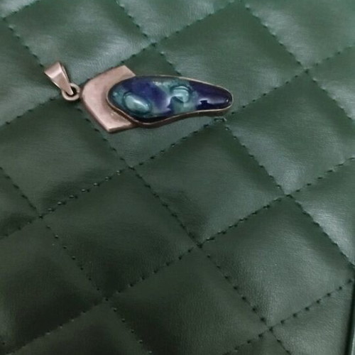 Silver pendant with blue stone used