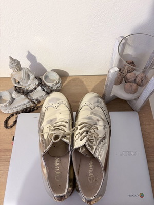 Gold color athletic shoes, size 40