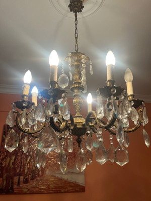 Bronze chandelier with 8 lights used, Bohemian crystals