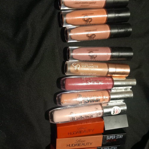 Liquid lipstick used, assorted lipsticks and lip gloss