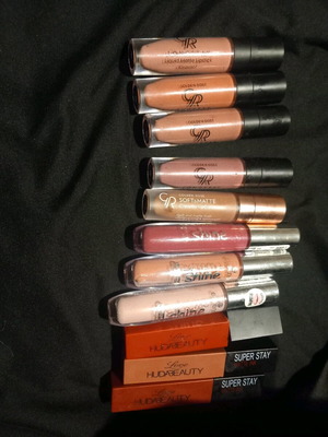 Liquid lipstick used, assorted lipsticks and lip gloss