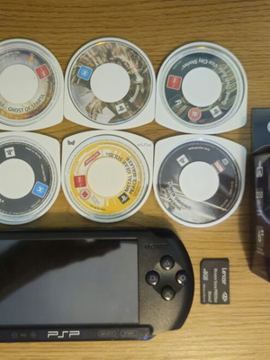Sony PSP Street E1004 console with 8 top games and new charger