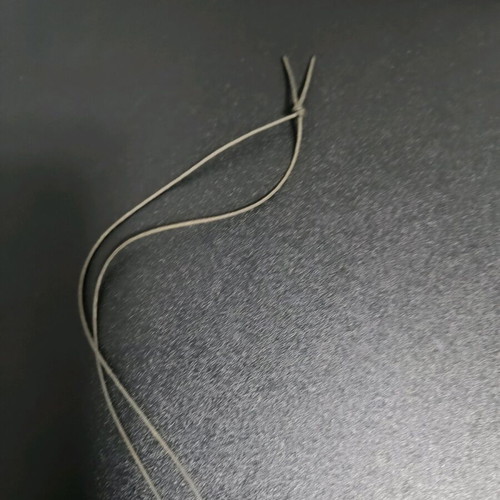 Long necklace like new, gold color with brown cord