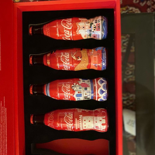 Collectible bottles and book 50 years Coca Cola new