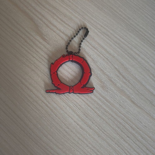 God of War keychain like new, black and red