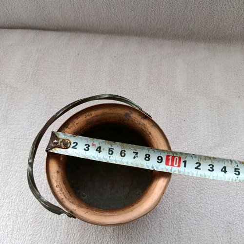 Vintage German copper vessel used with twisted handle and brass legs