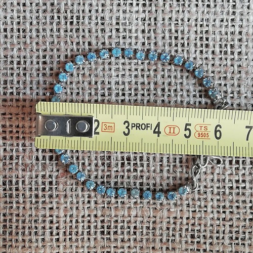 Steel bracelet new silver color decorated with blue zircon