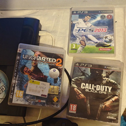 PlayStation 3 Super Slim console 1TB with controllers and games