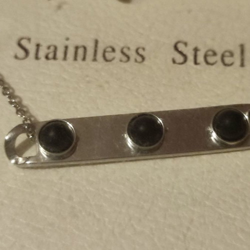Stainless steel necklace new with plate and 3 black beads