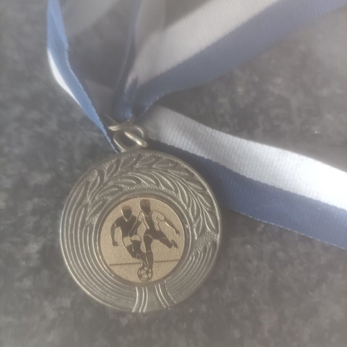 Football collectible medal with gold details