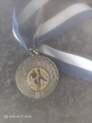 Football collectible medal with gold details