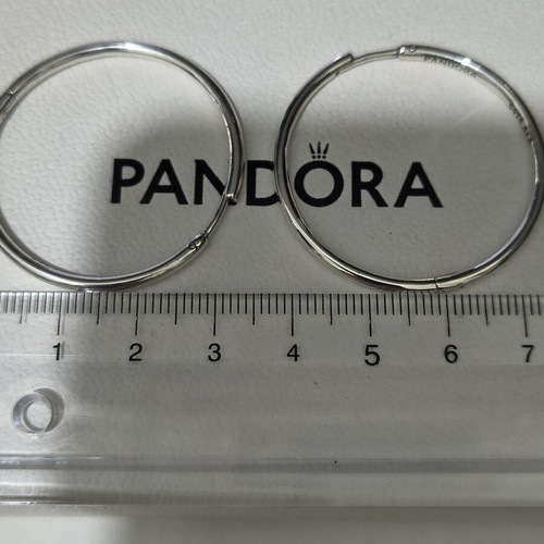 Pandora silver hoop earrings like new with engraved logo