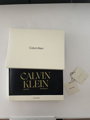 Calvin Klein graphic wristlet pouch, black and yellow
