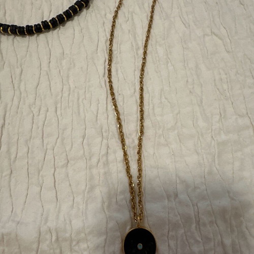 Necklace set used with black and gold beads and steel chain