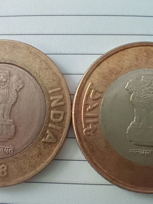 Indian rupee coins used, two ten-rupee pieces
