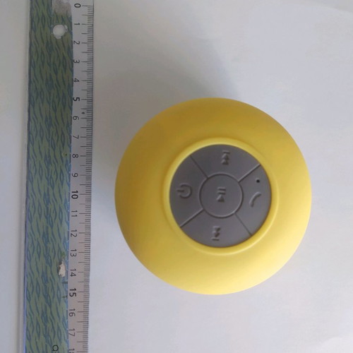 Bluetooth waterproof speaker yellow with detachable suction cup and charging cable