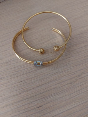 Two stainless steel bracelets, gold and silver