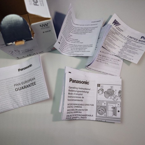 Empty box and manuals for Panasonic Lumix-G 25mm f/1.7 ASPH lens used