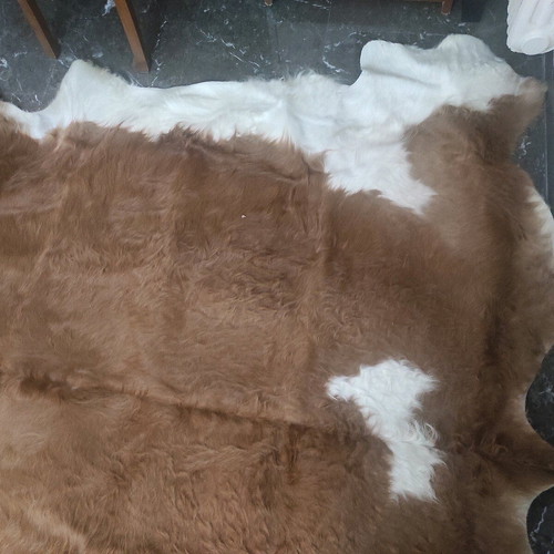 Cowhide rug like new, brown with white