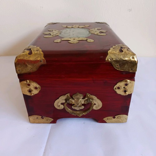 Wooden jewelry box used with brass decorative elements