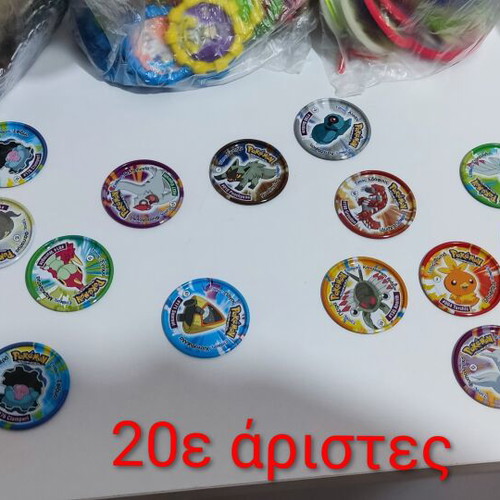 Various Pokémon and other collectible pogs