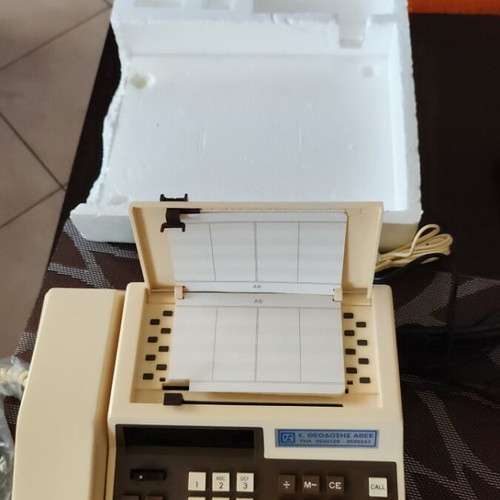 Vintage tabletop telephone with calculator and directory, new