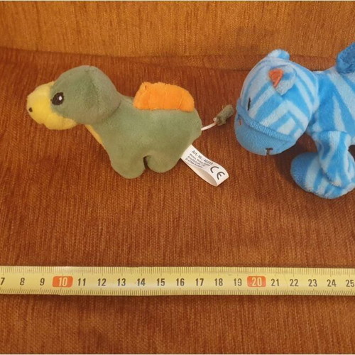 Two small plush toys with vibrating tails like new
